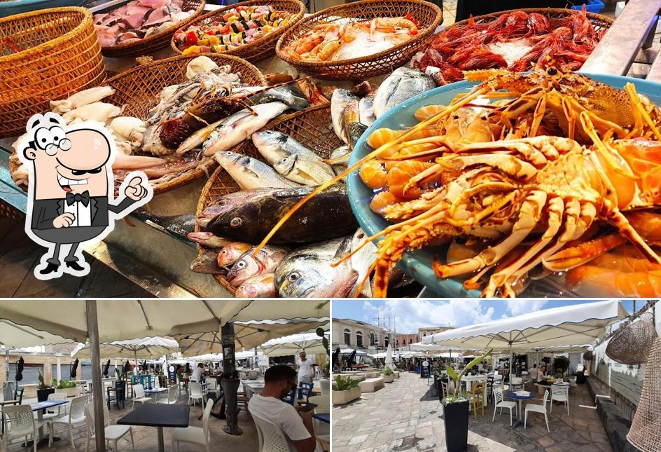 Questa è la immagine che presenta la interni e frutti di mare di Gallipoli Mercato Del Pesce/ Pescheria