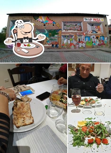 La foto della tavolo da pranzo e esterno di I Pisapia