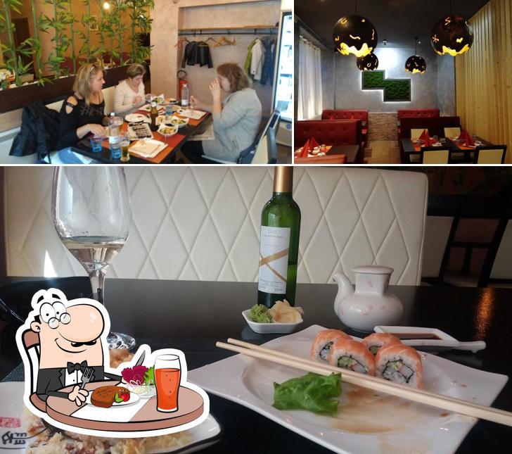 Guarda la immagine che mostra la tavolo da pranzo e interni di Sushi Centro