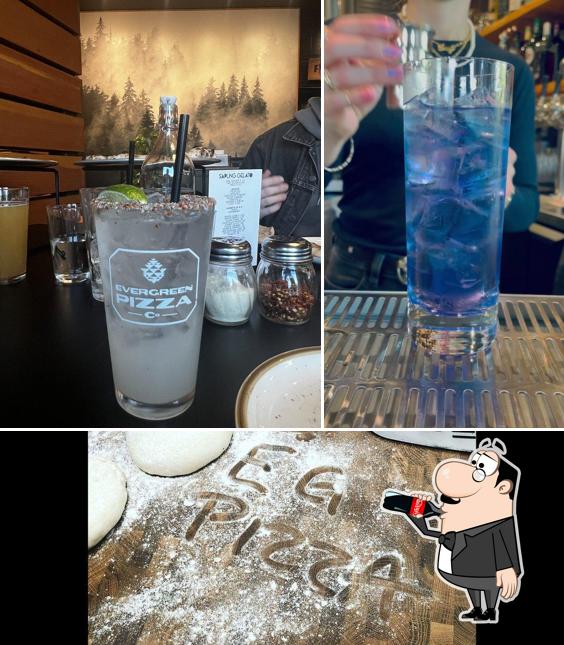 The photo of drink and food at Evergreen Pizza Co