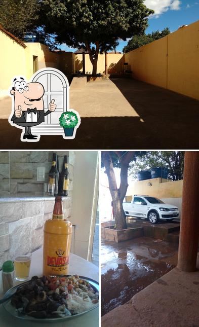 A imagem do Garagem Bar e Lava Jato’s exterior e comida