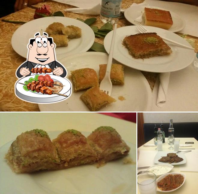 Parmi les diverses choses de la nourriture et la table à manger, une personne peut trouver sur Meydan Kebap Pizza Grill