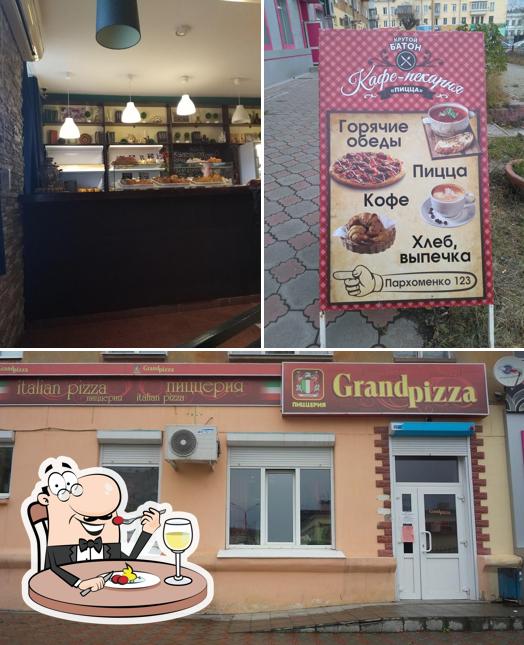 Посмотрите на это фото, где видны еда и внешнее оформление в Grandpizza