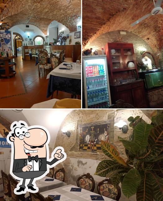 Dai un'occhiata agli interni di Osteria Du Cunfögu