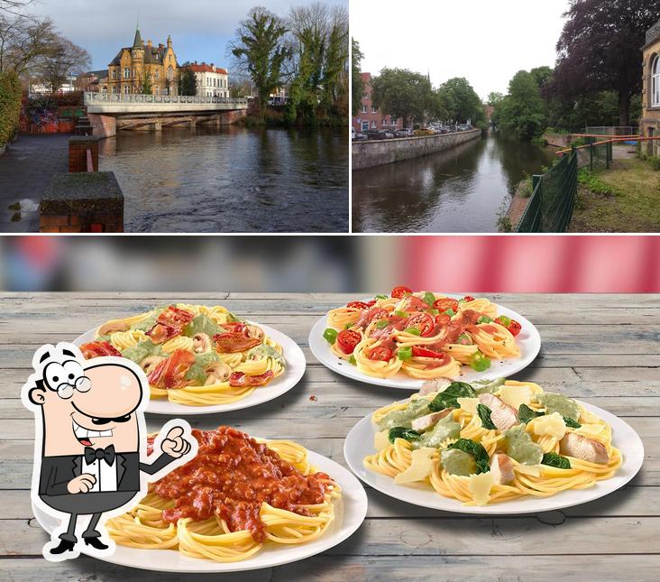 Взгляните на это изображение, где видны внешнее оформление и еда в Domino's Pizza Lüneburg Ost