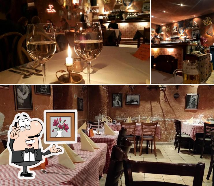 Take a look at the picture showing interior and wine at Osteria dell' Arte