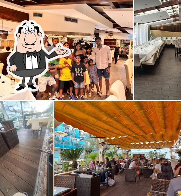 Installez-vous à l'une des tables de Little Bay Bar and Indian Restaurant