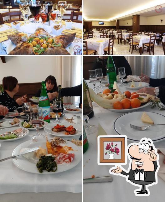 Trattoria e Pizzeria - Zi Marí si caratterizza per la interni e tavolo da pranzo