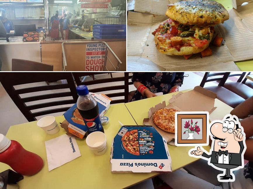 This is the picture showing interior and food at Domino's Pizza