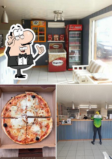 The picture of interior and pizza at Le Vésuve