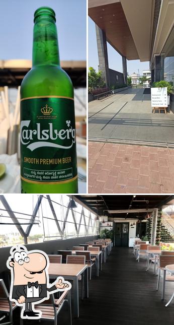 Check out the image depicting interior and beer at M pro restaurant