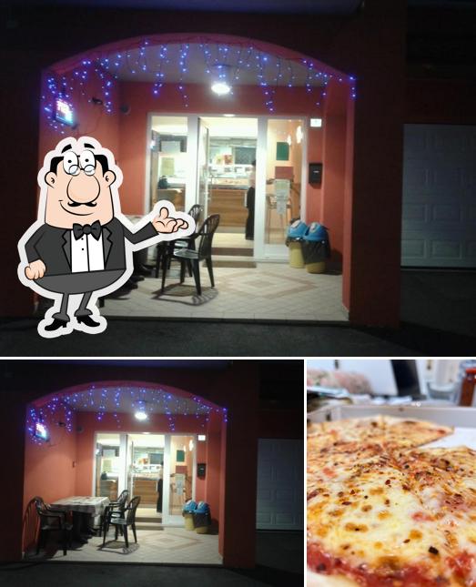 Questa è la immagine che mostra la interni e pizza di L'Oasi Del Gusto