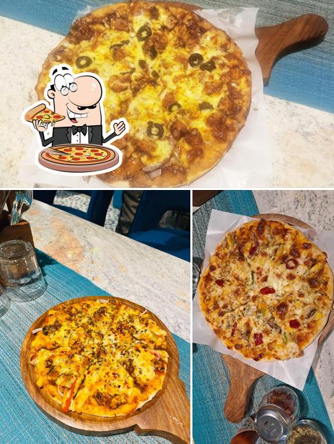 Get pizza at The Cafe Heaven
