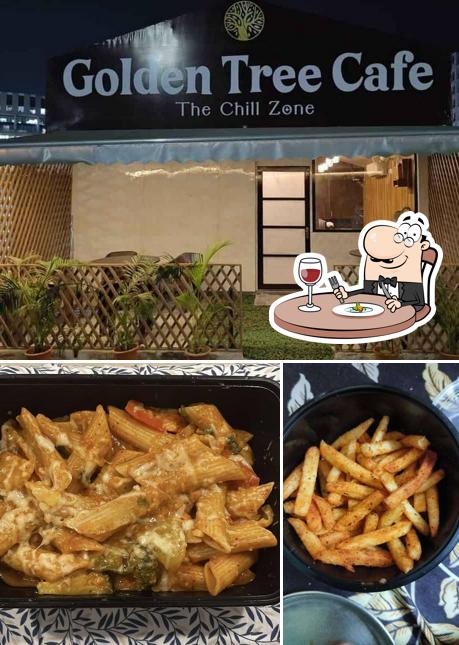 Take a look at the image showing food and interior at Golden Tree Cafe