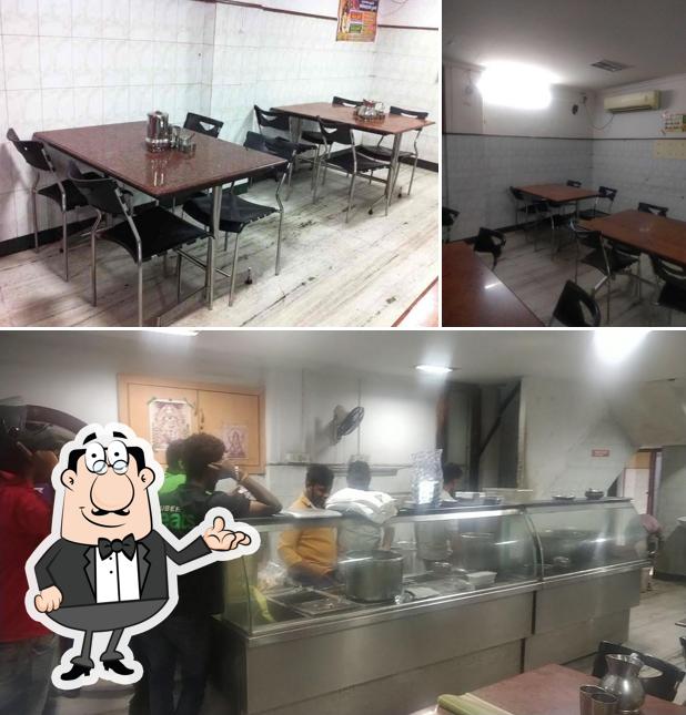 Take a seat at one of the tables at Madurai Pandian Mess