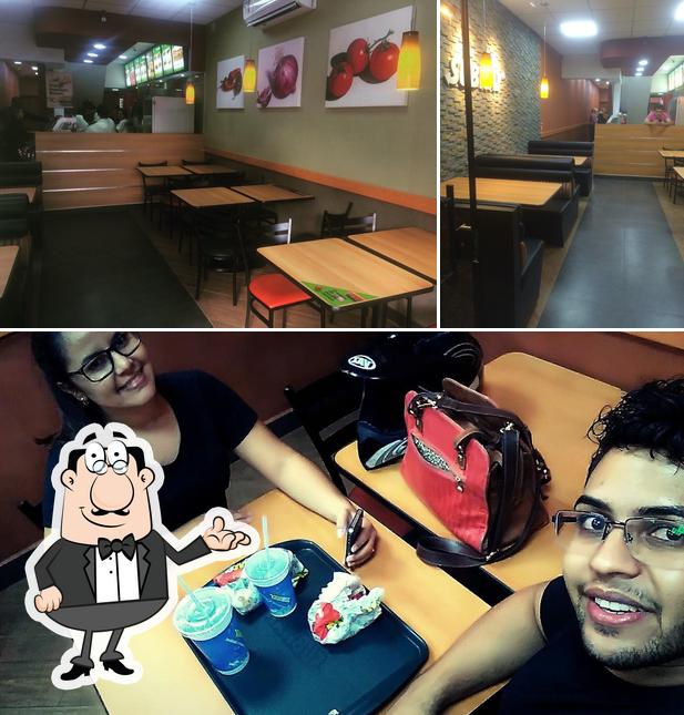 The picture of interior and cake at Subway Bragança Paulista