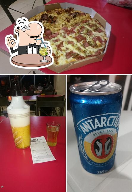 Check out the picture showing drink and pizza at Churrasquinho Do Zé !