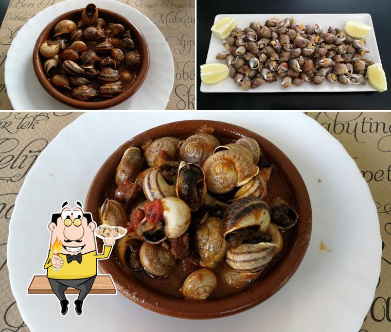 Get different seafood items served at Bar Galícia