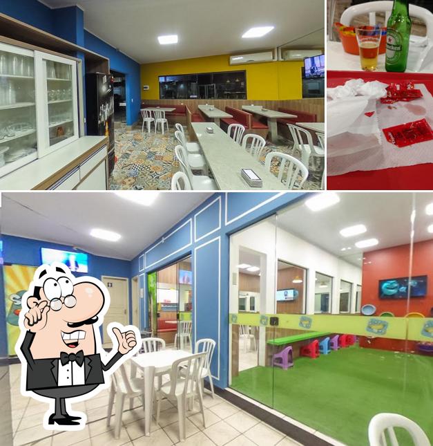 Entre diferentes coisas, interior e cerveja podem ser encontrados no Stop Dog Criciúma Tele Entrega de Cachorro Quente e Lanches