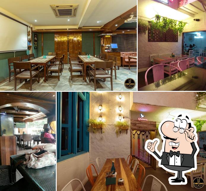 Take a seat at one of the tables at Chin Lung Restobar NEW BEL ROAD