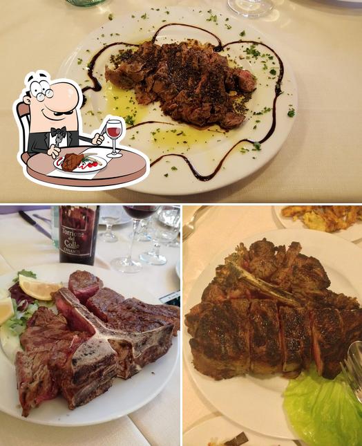 Ordina i un pasto a base di carne a Osteria Del Cavallino Bianco
