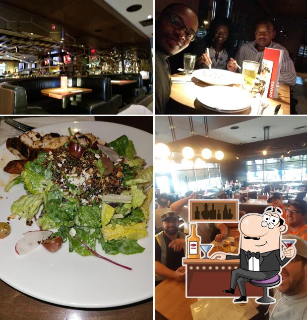 Взгляните на это изображение, где видны барная стойка и еда в Earls Kitchen + Bar