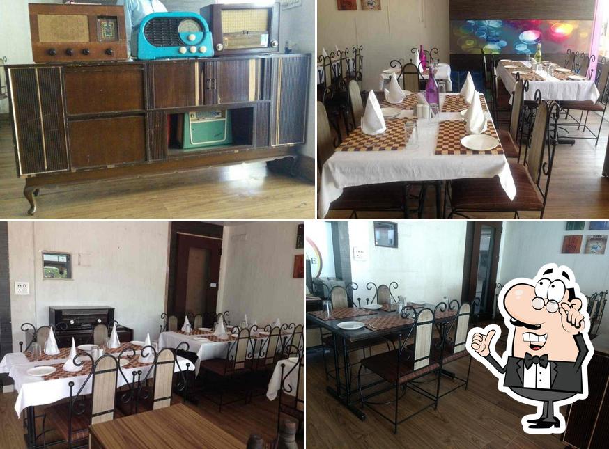 Take a seat at one of the tables at Guruji Ki Rasoi
