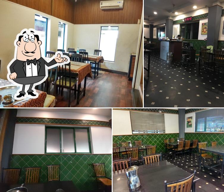 Take a seat at one of the tables at Farsa Pure Veg Manjeri