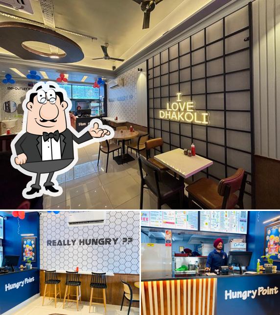 Take a seat at one of the tables at Hungry Point - Dhakoli Zirakpur