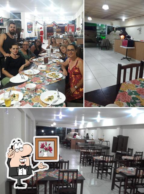 O interior do Restaurante E Pizzaria Casébre