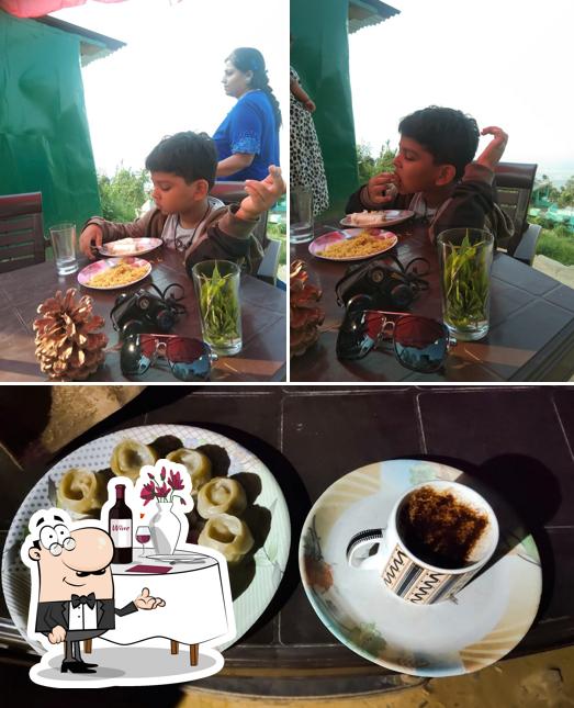 The image of dining table and food at Pahadi rasoi