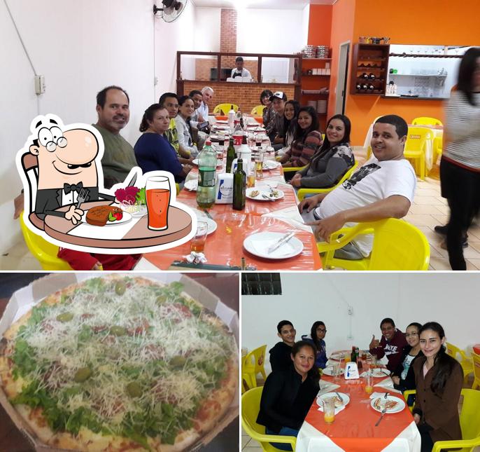 A foto a Parada Da Pizza’s mesa de jantar e comida