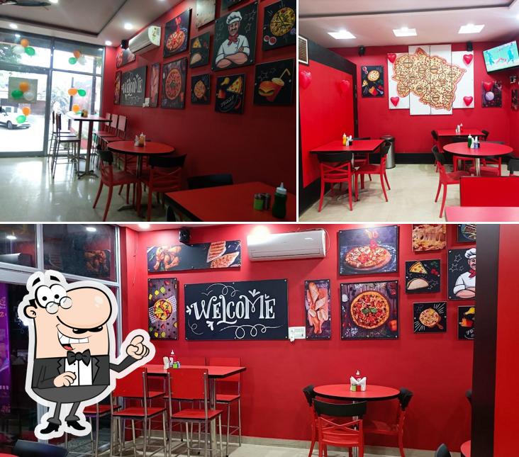 Take a seat at one of the tables at Hot Burst Pizza