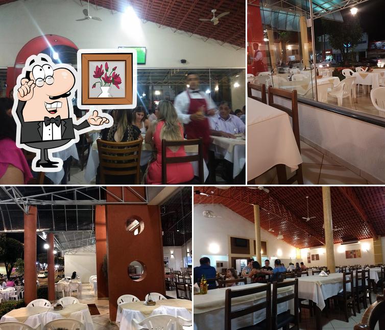 Sente em uma das mesas no Toldu's Pizzaria e Restaurante Cacoal