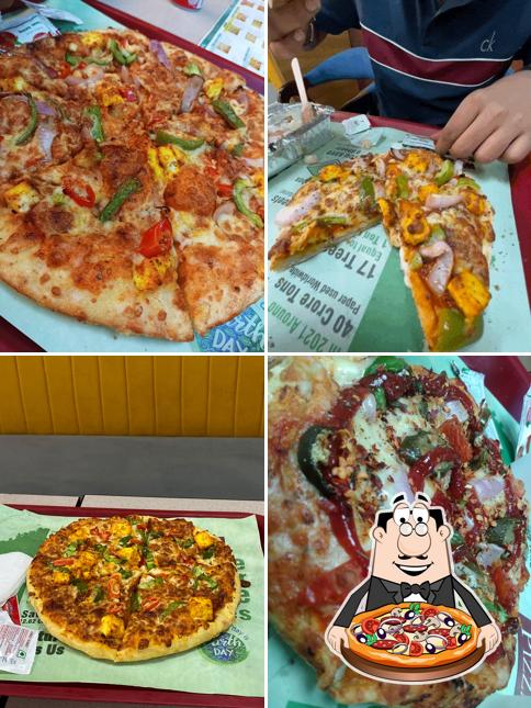 Try out pizza at Pizza Wings Kanpur (Mall Road)