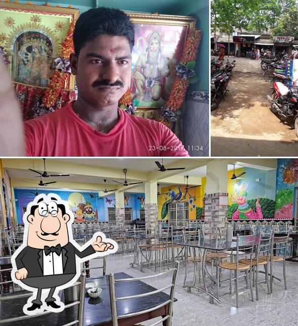 Take a seat at one of the tables at Gayatri Veg Restaurant