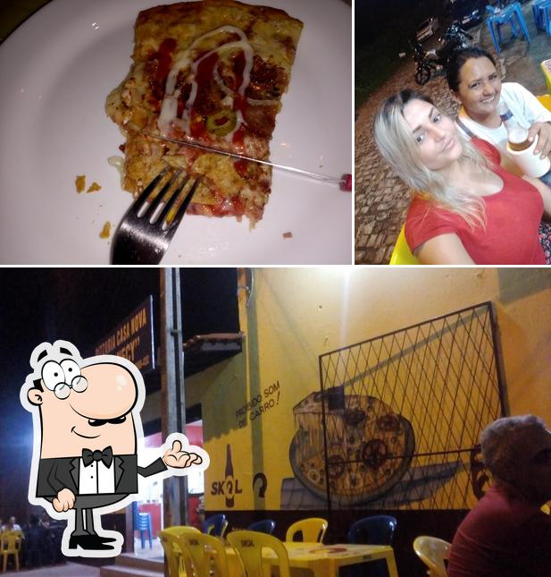 O PIZZARIA TIA NECY se destaca pelo interior e comida