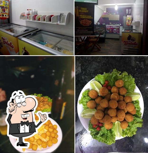 A imagem do Pizzaria Sabor de Minas’s interior e comida