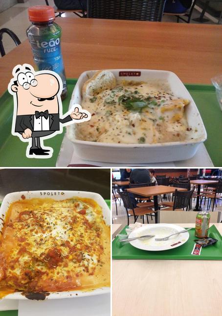 Confira a imagem ilustrando interior e pizza a Spoleto Culinária Italiana