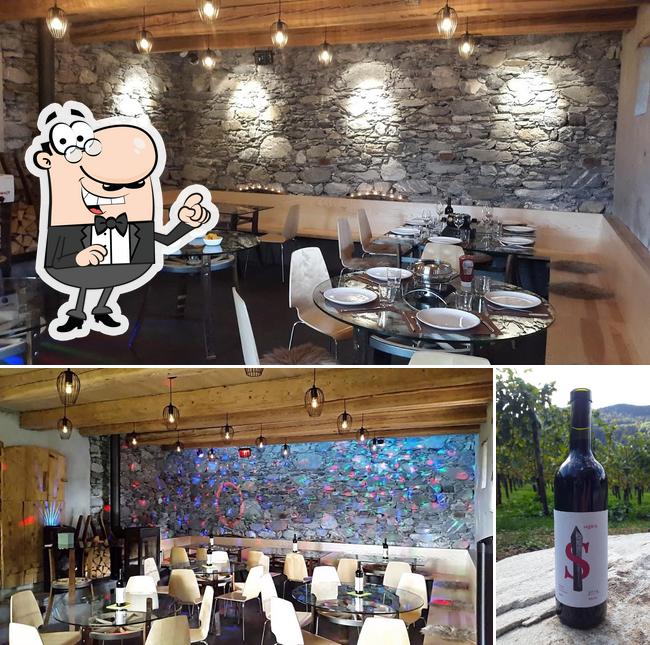 Take a look at the picture displaying interior and beverage at Weingut Reschu Torkel