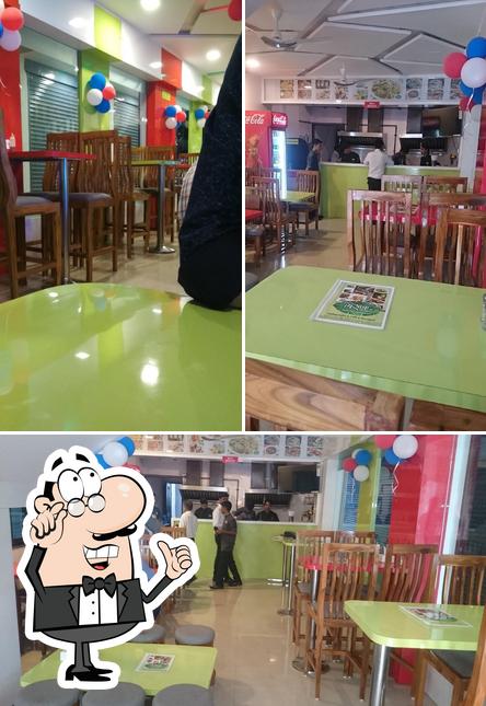 The interior of Madhuram Veg Restaurant