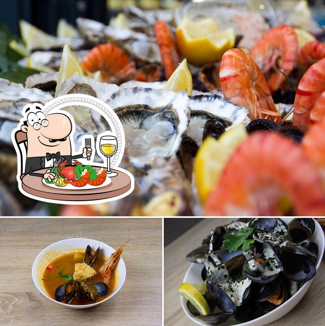 Essayez de nombreux plats à base de fruits de mer servis par Aux Bons Sens - Le Restaurant de la Poissonnerie