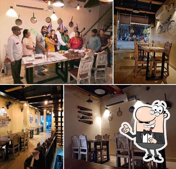 Take a seat at one of the tables at The Food Factory Best Restaurants In Kakinada