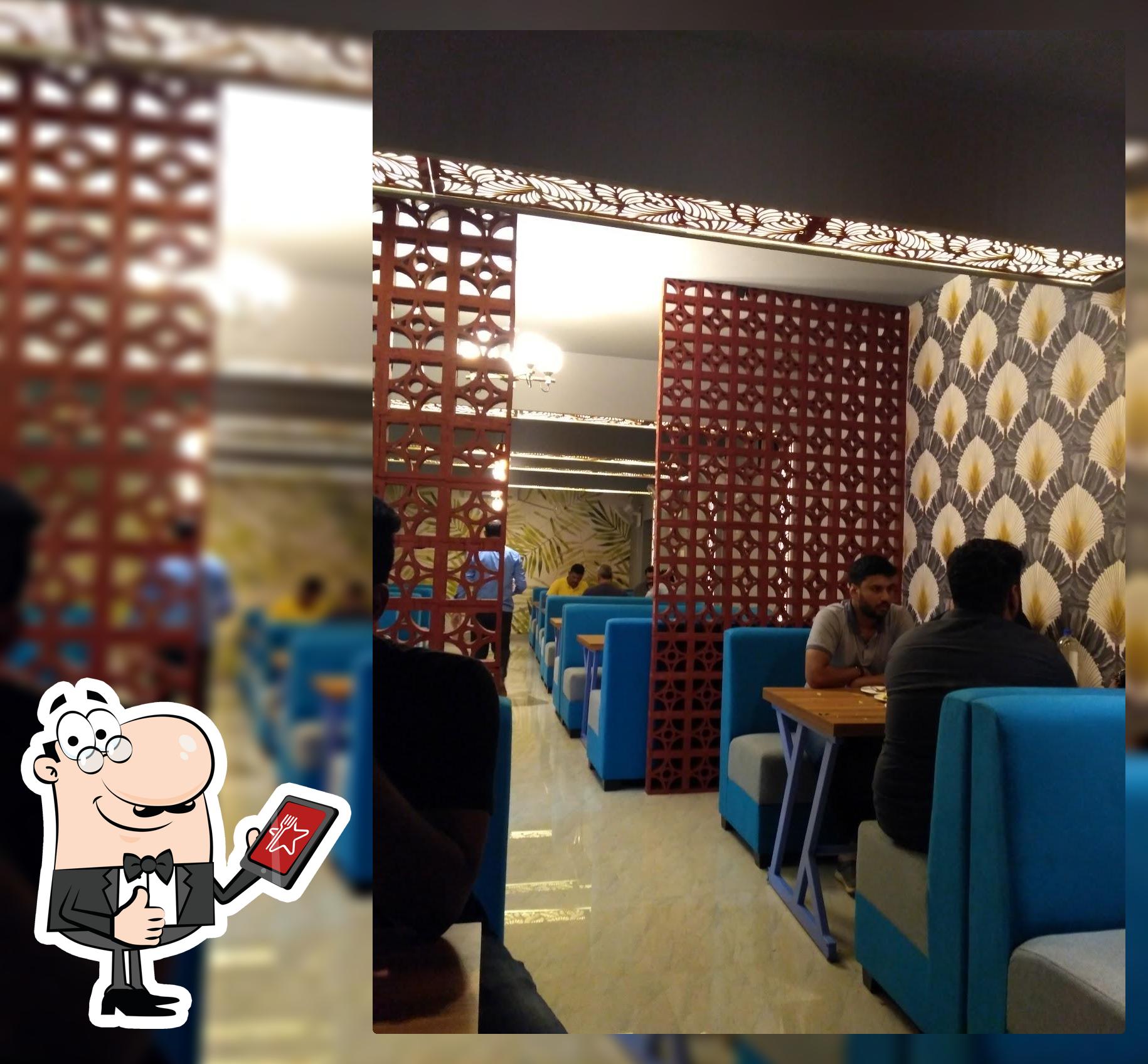 Take a seat at one of the tables at Gangotri Fishland