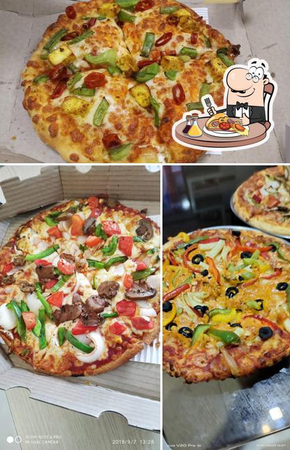 Try out pizza at Domino's Pizza