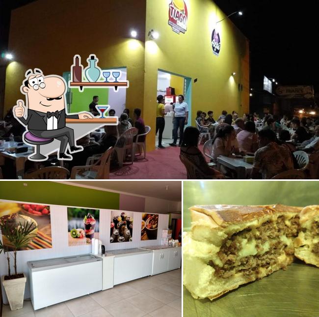 The picture of interior and sandwich at Tiago Lanches