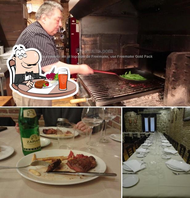 This is the picture displaying dining table and food at Asador Erri-Berri