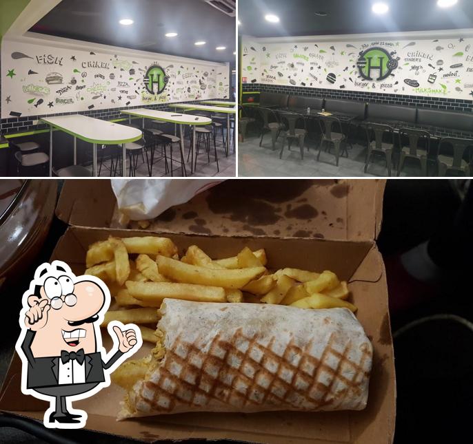 Take a look at the image showing interior and food at H Burger Et Pizza