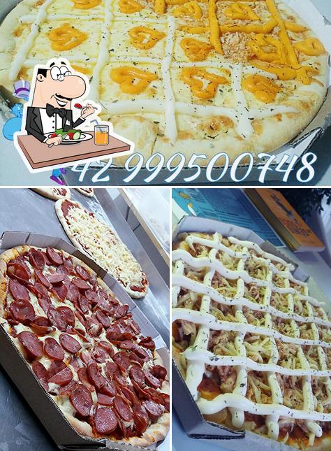 Comida em Pizzaria Gênios da villa