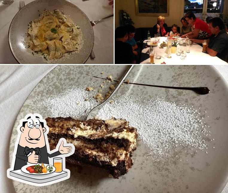 Questa è la foto che mostra la cibo e tavolo da pranzo di La Bula